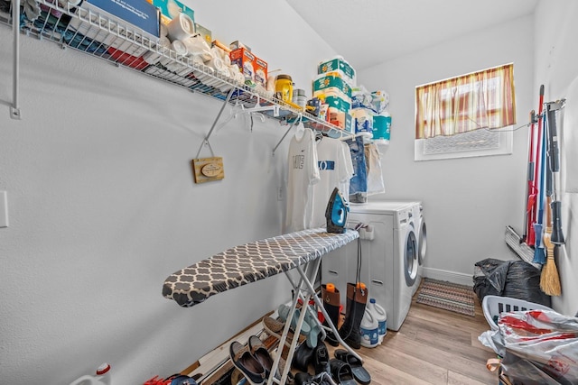 235 Largovista Dr, Oakland, FL 34787 - laundry room with independent washer and dryer, wood finished floors, laundry area, and baseboards