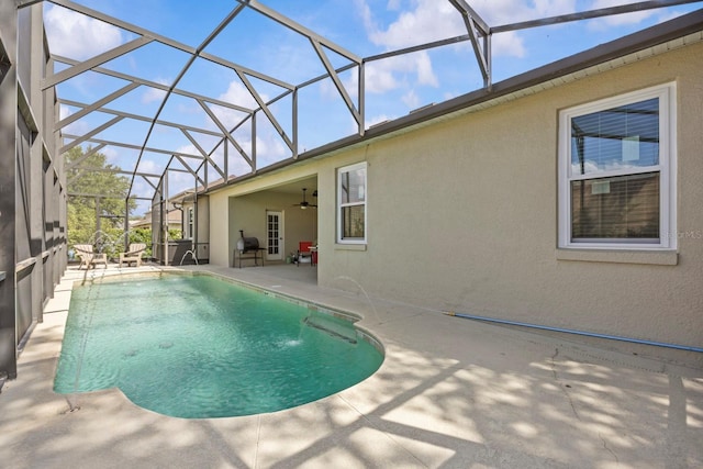 235 Largovista Dr, Oakland, FL 34787 - outdoor pool with glass enclosure, a patio, and a ceiling fan