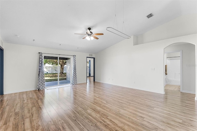 37 Lindsay Dr, Palm Coast, FL 32137 - empty room with arched walkways, light wood-type flooring, a ceiling fan, visible vents, and vaulted ceiling