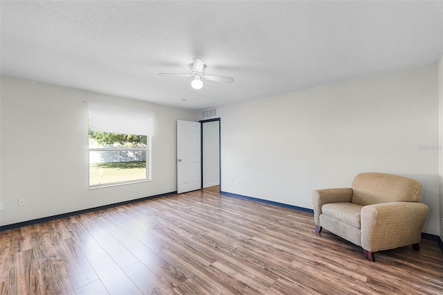 37 Lindsay Dr, Palm Coast, FL 32137 - sitting room featuring visible vents, baseboards, a ceiling fan, and wood finished floors