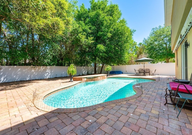 view of swimming pool featuring a fenced in pool, a patio area, and a fenced backyard