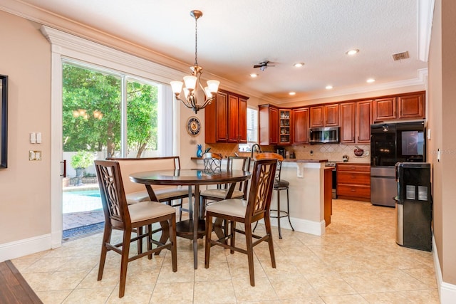 dining area featuring a chandelier, ornamental molding, and plenty of natural light