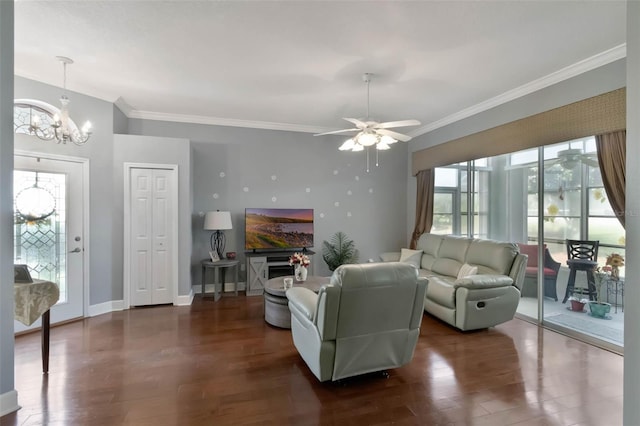 living area featuring baseboards, ceiling fan with notable chandelier, crown molding, and wood finished floors