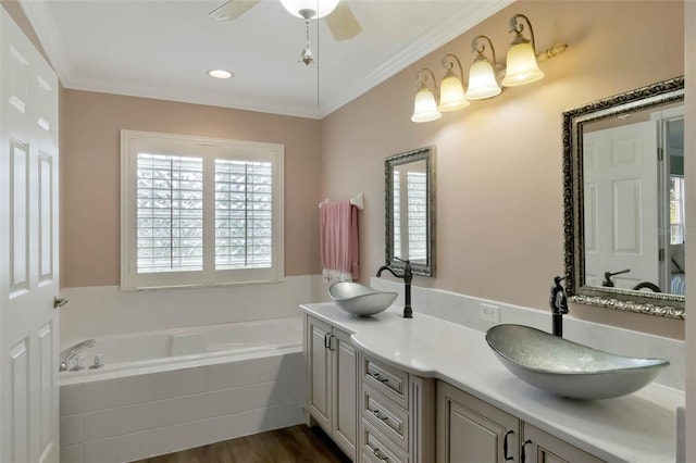 full bathroom with double vanity, a garden tub, a sink, and ceiling fan