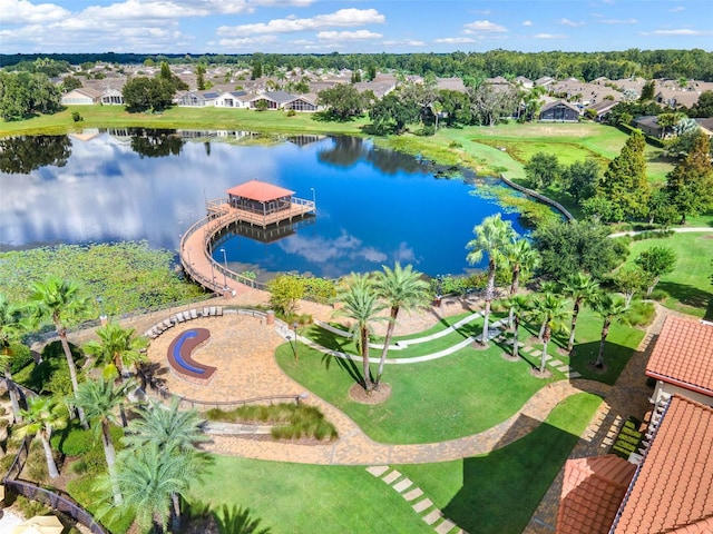 birds eye view of property featuring a water view and a residential view