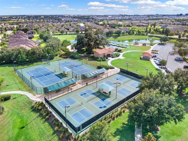 bird's eye view with a water view and a residential view