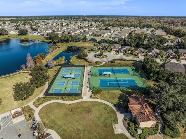 birds eye view of property with a water view and a residential view