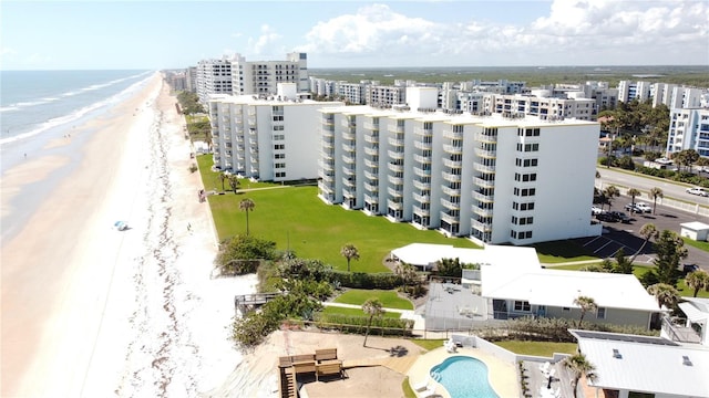 5203 S Atlantic Ave Unit 416B, New Smyrna Beach, FL 32169 - aerial view of apartment complex, unending shoreline, and a pool area