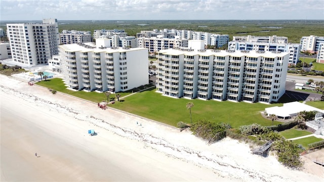5203 S Atlantic Ave Unit 416B, New Smyrna Beach, FL 32169 - aerial view of apartment complex and unending shoreline