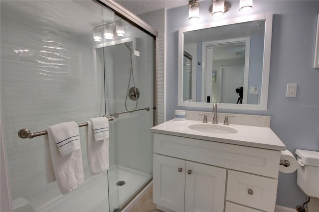 5203 S Atlantic Ave Unit 416B, New Smyrna Beach, FL 32169 - bathroom with a shower stall, vanity, and toilet