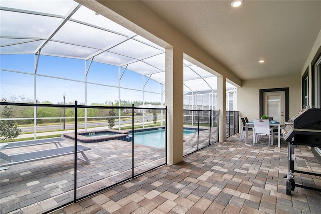 view of patio featuring a pool with connected hot tub, glass enclosure, outdoor dining area, and area for grilling