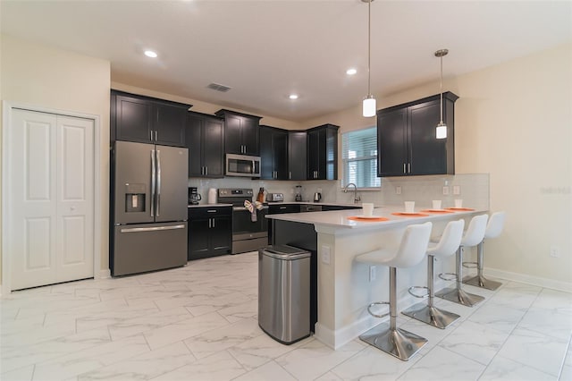kitchen featuring visible vents, light countertops, appliances with stainless steel finishes, and marble finish floor