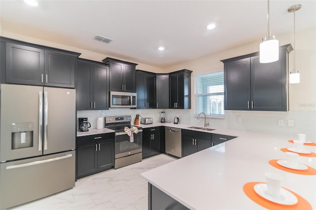 kitchen with visible vents, a sink, dark cabinetry, stainless steel appliances, and marble finish floor