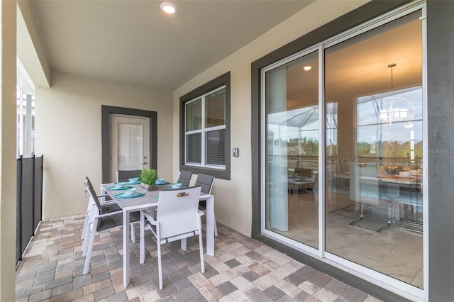 balcony with a patio and outdoor dining area