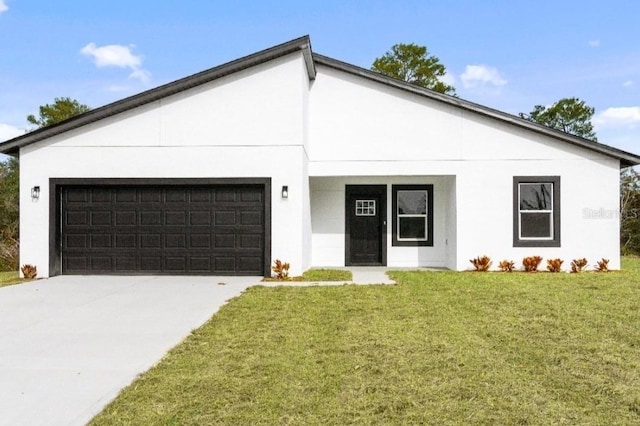 contemporary house with an attached garage, driveway, stucco siding, and a front yard