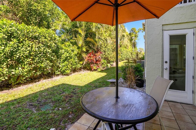 view of yard with outdoor dining space and a patio area