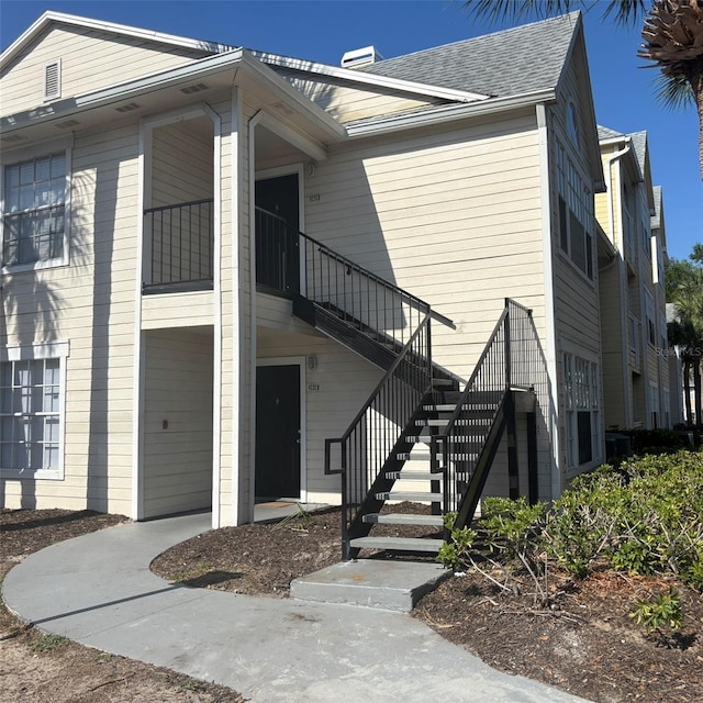 view of home's exterior with stairway