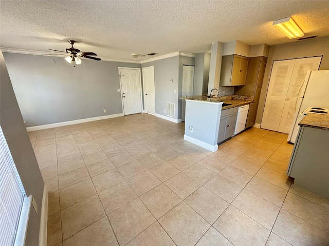 kitchen featuring a ceiling fan, light tile patterned flooring, ornamental molding, and white dishwasher