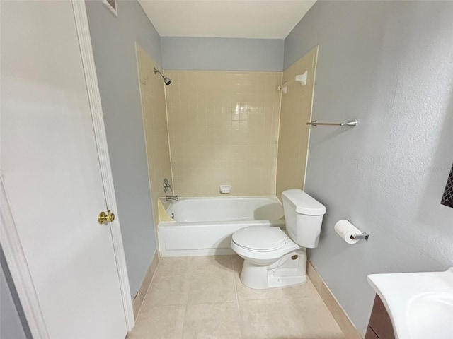 bathroom featuring shower / washtub combination, vanity, tile patterned flooring, toilet, and baseboards