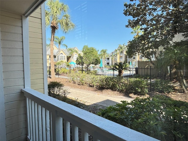 view of yard with a residential view and fence