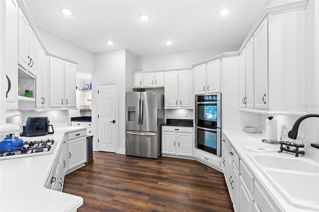 kitchen featuring open shelves, a sink, appliances with stainless steel finishes, recessed lighting, and white cabinetry