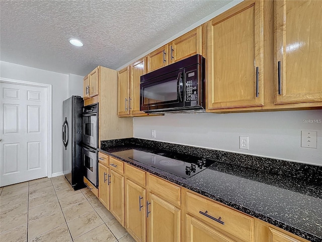 1176 Liberty Hall Dr, Kissimmee, FL 34746 - kitchen with black appliances, dark stone counters, a textured ceiling, recessed lighting, and light tile patterned flooring