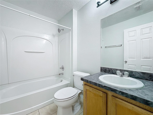 1176 Liberty Hall Dr, Kissimmee, FL 34746 - full bath featuring toilet, bathtub / shower combination, vanity, a textured ceiling, and tile patterned floors