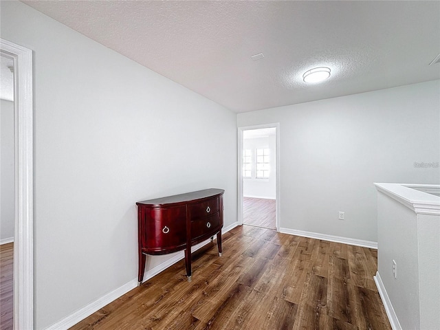 1176 Liberty Hall Dr, Kissimmee, FL 34746 - interior space with wood finished floors, baseboards, and a textured ceiling