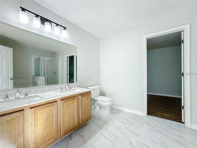 1176 Liberty Hall Dr, Kissimmee, FL 34746 - full bathroom with a shower stall, marble look tile flooring, toilet, double vanity, and a textured ceiling