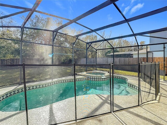 1176 Liberty Hall Dr, Kissimmee, FL 34746 - view of pool featuring an in-ground hot tub, a fenced backyard, and a patio area