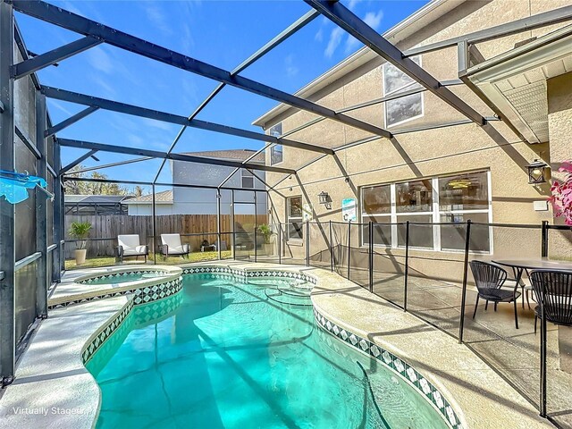 1176 Liberty Hall Dr, Kissimmee, FL 34746 - view of pool with a patio, a pool with connected hot tub, fence, and a lanai