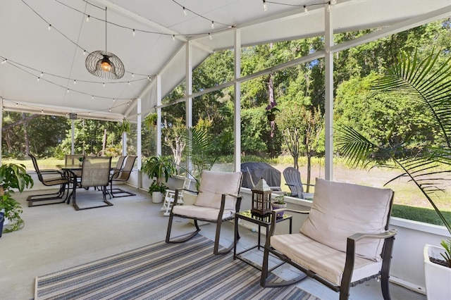 sunroom featuring outdoor dining space