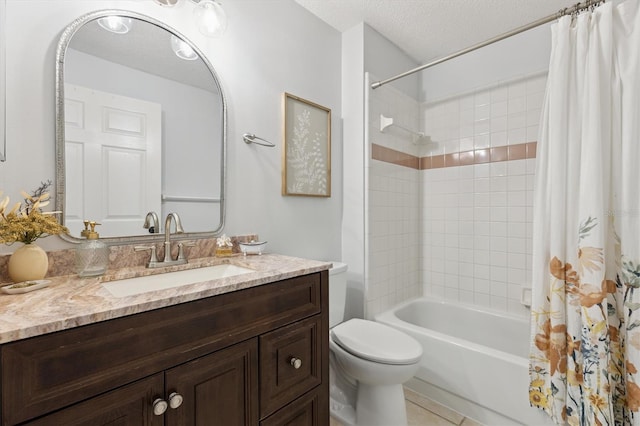 bathroom with tile patterned floors, toilet, vanity, a textured ceiling, and shower / bath combo