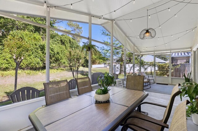 sunroom with outdoor dining space