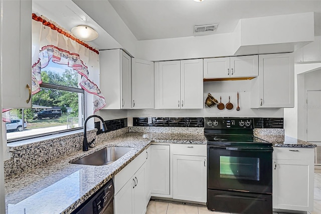 kitchen featuring a sink, visible vents, white cabinets, and black range with electric stovetop