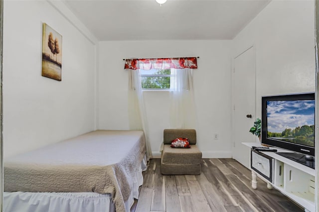 bedroom with wood finished floors