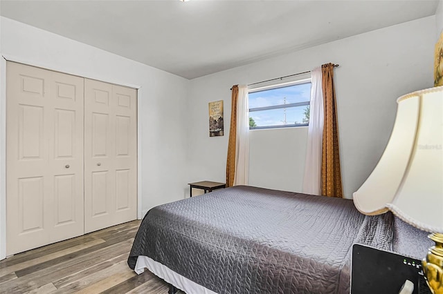bedroom with a closet and wood finished floors