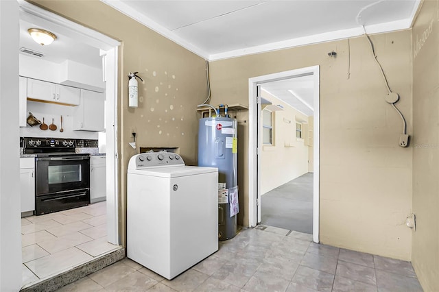 laundry area featuring electric water heater, light tile patterned floors, washer / dryer, laundry area, and visible vents