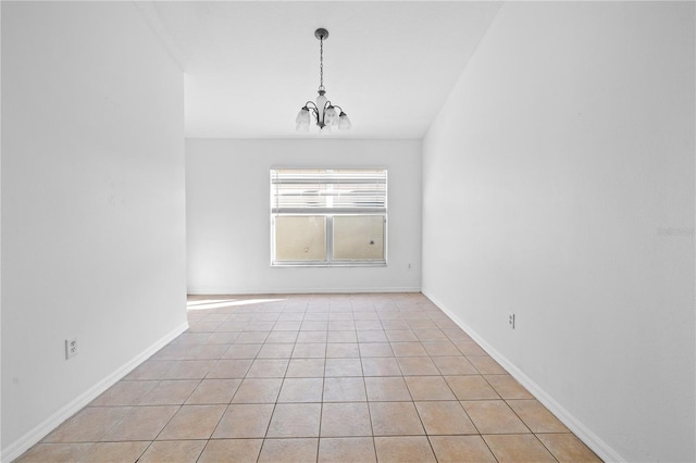 12511 Lake Vista Dr, Gibsonton, FL 33534 - empty room featuring baseboards, an inviting chandelier, and light tile patterned flooring