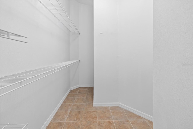 12511 Lake Vista Dr, Gibsonton, FL 33534 - spacious closet featuring light tile patterned floors