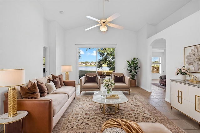 12511 Lake Vista Dr, Gibsonton, FL 33534 - living area featuring a water view, tile patterned flooring, ceiling fan, high vaulted ceiling, and arched walkways