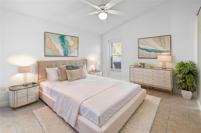 12511 Lake Vista Dr, Gibsonton, FL 33534 - bedroom with light tile patterned floors, baseboards, a ceiling fan, and vaulted ceiling