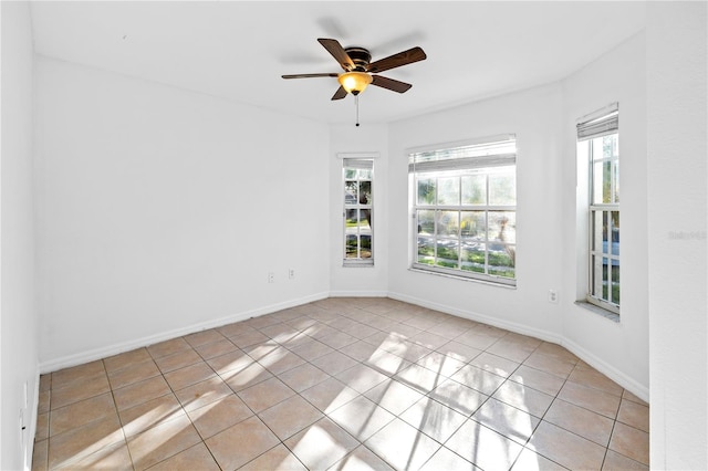12511 Lake Vista Dr, Gibsonton, FL 33534 - spare room with a ceiling fan and light tile patterned flooring