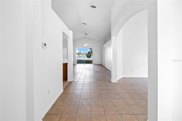 12511 Lake Vista Dr, Gibsonton, FL 33534 - hall featuring visible vents, light tile patterned floors, baseboards, and vaulted ceiling