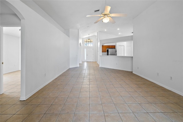 12511 Lake Vista Dr, Gibsonton, FL 33534 - unfurnished living room featuring light tile patterned floors, ceiling fan, arched walkways, visible vents, and lofted ceiling