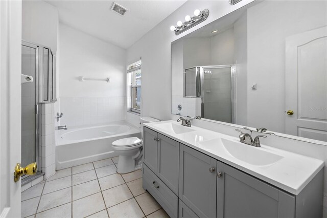 12511 Lake Vista Dr, Gibsonton, FL 33534 - bathroom featuring a shower stall, tile patterned floors, a sink, and visible vents
