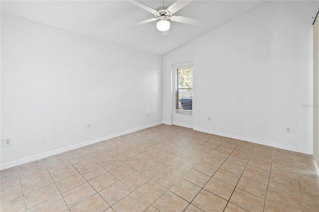 12511 Lake Vista Dr, Gibsonton, FL 33534 - unfurnished room featuring lofted ceiling, baseboards, light tile patterned floors, and ceiling fan
