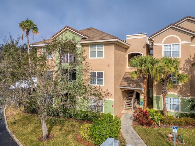 4897 Cypress Woods Dr Unit 6314, Orlando, FL 32811 - view of front of house featuring stucco siding and stairway
