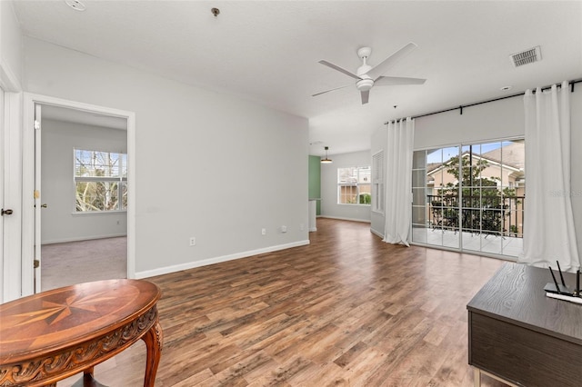 4897 Cypress Woods Dr Unit 6314, Orlando, FL 32811 - living area featuring visible vents, baseboards, a ceiling fan, and wood finished floors