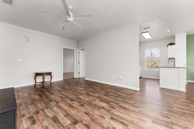 4897 Cypress Woods Dr Unit 6314, Orlando, FL 32811 - unfurnished living room with wood finished floors, baseboards, a ceiling fan, and visible vents